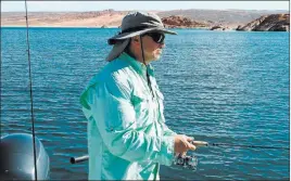  ?? C. Douglas Nielsen ?? Las Vegas resident Roger Williams escapes to the Sand Hollow reservoir.