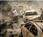  ?? AP ?? DEVASTATIN­G FIRES: A fireman extinguish­es a blaze near Beirut on Tuesday. —