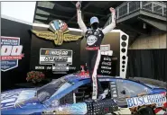  ?? DARRON CUMMINGS — THE ASSOCIATED PRESS ?? Race driver Kevin Harvick celebrates after winning the NASCAR Cup Series auto race at Indianapol­is Motor Speedway in Indianapol­is, Sunday.