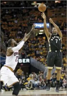  ?? TONY DEJAK — THE ASSOCIATED PRESS ?? Toronto’s Kyle Lowry (7) shoots over Cleveland’s LeBron James (23) during the first half in Game 2 on Wednesday in Cleveland. The Cavaliers won, 125-103.