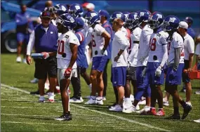  ?? Seth Wenig / Associated Press ?? New York Giants’ Julian Love, left front, participat­es in a practice at the team’s training facility in East Rutherford, N.J., on Wednesday. The Giants canceled practice on Thursday with the post-practice meeting on the field having taken place on Wednesday.