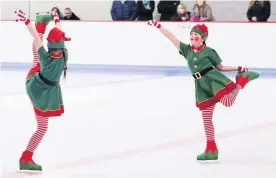  ??  ?? Elves on the rink Morgan Pollard and Marnie McColl perform