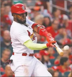  ?? The Associated Press ?? SOLO SHOT: Marcell Ozuna hits a solo home run for the Cardinals Wednesday during the second inning of a 4-2 win against the Washington Nationals in St. Louis.