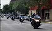 ?? ?? A convoy of Toy Run participan­ts ride through downtown Swift Current, Sept. 17.