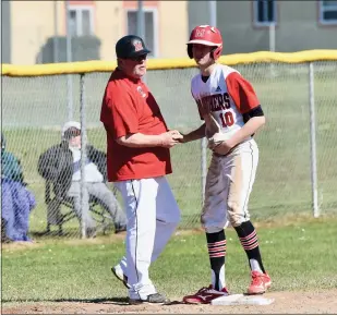  ?? JOSE QUEZADA — HUMSPORT ?? McKinleyvi­lle’s pitcher Cameron Saso has a word with head coach Scott St. John after stealing third base during Saturday’s 9-5win over visiting Willits, at McKinleyvi­lle High. Saso pitched a perfect game in game two.