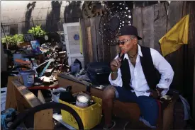  ?? DAI SUGANO — STAFF ARCHIVES ?? Jonathan Vallot, 57, who lives in the homeless encampment located along Coleman Avenue in San Jose, sits by his living space as city cleanup crews remove items and trash from outside of some tents and RVs on June 28, 2021.