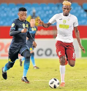  ?? Picture: LEFTY SHIVAMBU/GALLO IMAGES ?? FOOT-SLOGGING: Motjeka Madisha of Mamelodi Sundowns and Simphiwe Dlamini of EC Bees in hot pursuit of the ball during their Nedbank Cup, last 16 match at Loftus Stadium in Pretoria in March.