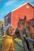  ?? PHOTO BY MARK BOWIE ?? Local author Mary Cuffe Perez recently released her newest book “Barn Stories,” inspired by her time working at a small horse boarding farm in Galway.