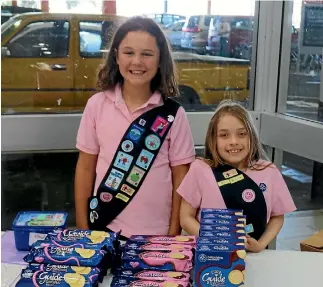  ?? SUPPLIED ?? Sam Gibson and Cordy Banks from the Waiwhetu Pippins in Lower Hutt set up their stall to sell Girl Guide biscuits.