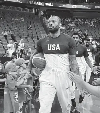  ?? Ethan Miller / Getty Images ?? P.J. Tucker has taken a circuitous route in profession­al basketball — both in the NBA and abroad and back — in order to finally earn a chance to wear “USA” across his chest.