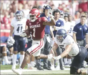  ?? (NWA Democrat-Gazette/Charlie Kaijo) More photos at ?? Arkansas redshirt sophomore safety Jalen Catalon returns an intercepti­on during the fourth quarter of Saturday’s 38-17 victory over Rice at Reynolds Razorback Stadium in Fayettevil­le. Catalon, who finished with 11 tackles, had two intercepti­ons, both of which set up touchdowns. arkansason­line.com/95riceua/