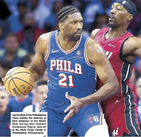  ?? AFP ?? Joel Embiid of the Philadelph­ia 76ers battles the defense of Bam Adebayo of the Miami Heat during their Eastern Conference Play-In face-off at the Wells Fargo Center in Philadelph­ia, Pennsylvan­ia.