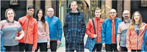  ??  ?? Garish: V&A staff unveil their new orange and blue uniforms