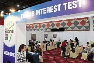  ??  ?? Students taking a career test at the SEGi University & Colleges booth at the Star Education Fair 2019 in Sunway Convention Centre.