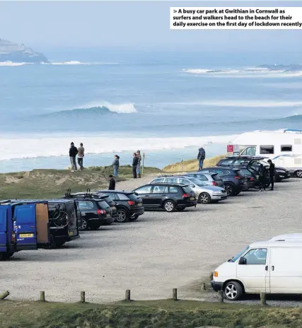  ??  ?? A busy car park at Gwithian in Cornwall as surfers and walkers head to the beach for their daily exercise on the first day of lockdown recently