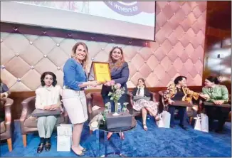  ?? ?? IWG President Ghada Shawky, (left), presenting moderator Chaitali B Roy with a plaque of appreciati­on.