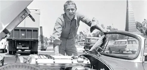  ?? — CBS ?? Actor Steve McQueen, seen with his Jaguar XKSS, special racing model, in 1960, was also an avid car racer.