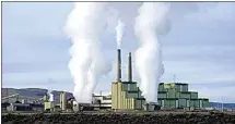  ?? RICK BOWMER / AP FILE ?? Steam billows from a coal-fired power plant Nov. 18, 2021, in Craig, Colo. The Supreme Court on Thursday limited how the nation’s main anti-air pollution law can be used to reduce carbon dioxide emissions from power plants.