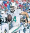  ?? ADRIAN KRAUS/AP ?? Dolphins quarterbac­k Ryan Fitzpatric­k runs for a touchdown against the Buffalo Bills on Oct. 20.