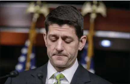  ?? J. SCOTT APPLEWHITE — ASSOCIATED PRESS ?? House Speaker Paul Ryan pauses as he announces he is pulling the troubled Republican health care overhaul bill off the House floor on Friday.