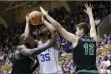  ?? THE ASSOCIATED PRESS ?? Duke’s Marvin Bagley III (35) is pressured by Utah Valley’s Akolda Manyang (0) and Joonas Tahvanaine­n (12) during Saturday’s game.