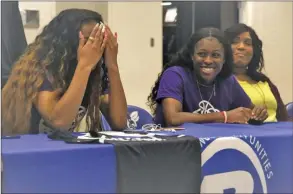  ?? HUNTER High/special to The Saline Courier ?? Bryant Lady Hornets basketball players Allison Steen, left, and Kalia Walker react after signing to play basketball with the Arkansas Baptist College Buffaloes this past Thursday in Bryant.