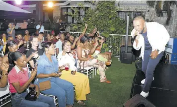  ?? (Photos: Joseph Wellington) ?? Agent Sasco offers an intimate performanc­e for a group of fans on Saturday evening. The event was organised by the JN Group.