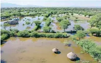  ??  ?? An aerial view shows settlement­s in the Salabani village where the rising water levels of Lake Baringo have now flooded displacing entire villages near Marigat, Baringo county on the Kenyan Rift Valley.