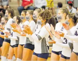  ?? GERALD LEONG/ORLANDO SENTINEL ?? Lake Nona High School volleyball players assemble before a Sept. 23 match against Lyman in Longwood. Lyman is No. 1 and Lake Nona No 2 in the area rankings.