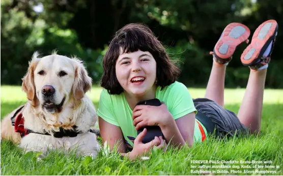  ??  ?? FOREVER PALS: Charlotte Bratu-Breen with her autism assistance dog, Koda, at her home in Ballyboden in Dublin. Photo: Steve Humphreys