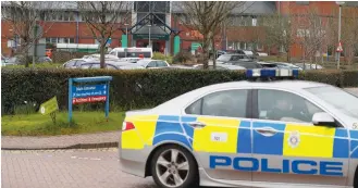  ?? (Peter Nicholls/Reuters) ?? BRITISH POLICE patrol the Salisbury District Hospital yesterday after Yulia Skripal was discharged.