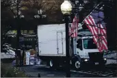  ?? GERALD HERBERT — THE ASSOCIATED PRESS ?? A truck arrives to pick up boxes that were moved out of the Eisenhower Executive Office building inside the White House complex in Washington on Thursday.