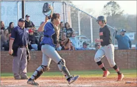  ?? / Contribute­d by Gail Conner ?? Cedartown players trotted in to home plate for a score against Model last week.