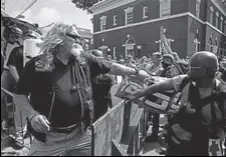  ?? REUTERS ?? Members of a white nationalis­t group clash with counterpro­testers in Charlottes­ville, Virginia.