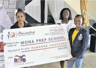  ?? ?? Angela Amir (left), director of Amazing Concrete Finishes Limited, presents a symbolic cheque for $500,000 to Citrine Dixon (centre), acting principal of Mona Prep, while the school’s head girl and track athlete Soleil Blake looks on.