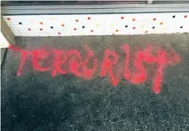  ?? COURTESY FACEBOOK ?? The word ‘terrorist’ written in red chalk at Pyramid Cafe on Cordova Road.