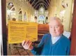  ??  ?? Rocky future: Father Barry Scannell with the church’s yellow earthquake notice.