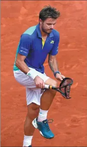  ?? PASCAL ROSSIGNOL / REUTERS ?? Switzerlan­d’s Stan Wawrinka breaks his racket in frustratio­n during his straight-sets loss to Rafael Nadal of Spain in Sunday’s French Open final at Roland Garros, Paris.