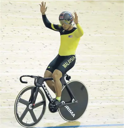  ?? Picture: Getty. ?? A world champion at last: Awang Azizulhasn­i of Malaysia.