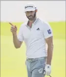  ?? Sam Greenwood / Getty Images ?? Dustin Johnson reacts after chipping in on the eighth hole in the second round of the Tour Championsh­ip on Saturday.