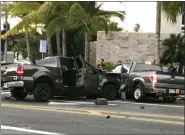  ?? CINDY ELLEN RUSSELL — HONOLULU STAR-ADVERTISER VIA AP ?? This Monday photo shows a multi-vehicle accident involving two trucks and a bicyclist in Honolulu. Police say a suspected drunk driver slammed into a crowded Honolulu intersecti­on, killing two pedestrian­s and a bicyclist and injuring five people including himself.