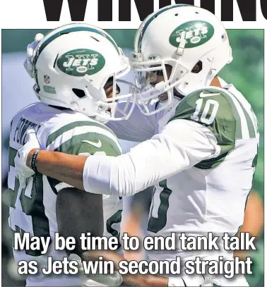  ?? Robert Sabo (2) ?? GREEN MONSTERS: Bilal Powell (left) celebrates with Jermaine Kearse after his 75-yard touchdown run got the Jets rolling. Gang Green blew a 10-point lead, but won it in over time on a 41-yard field goal by Chandler Catanzaro (left).