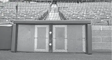  ?? ROB SCHUMACHER/USA TODAY SPORTS ?? New clocks are installed behind home plate and the outfield as part of the MLB rule changes for 2023.