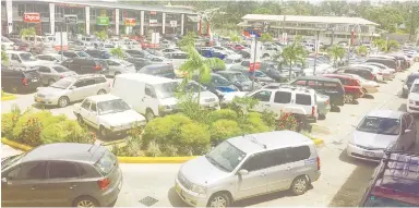  ??  ?? An extra full Damodar City carpark yesterday as people flocked in to enjoy their Easter Weekend.