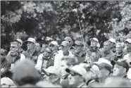  ?? PATRICK SMITH / GETTY IMAGES / AFP ?? Tiger Woods tracks his shot from the ninth tee in the final round of the Masters on Sunday.