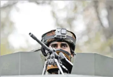  ?? TAUSEEF MUSTAFA/AFP ?? An Indian army soldiers looks on during a cordon and search operation for suspected militants in Shuhama on the outskirts of Srinagar on November 5.