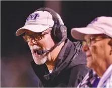  ?? STAFF PHOTO BY ROBIN RUDD ?? Dale Pruitt coaches Marion County’s football team during a home game against Meigs County in October. Pruitt is returning to his alma mater, Alabama’s Plainview, for a third stint as head coach.