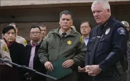  ?? DAMIAN DOVARGANES — THE ASSOCIATED PRESS ?? Los Angeles County Sheriff Robert Luna, center, and Monterey Park Chief of Police Scott Wiese, far right, brief the media outside the Civic Center in Monterey Park on Sunday. At left is, Rep. Judy Chu, and Monterrey Park Mayor Henry Lo. A mass shooting at a Los Angeles-area ballroom dance club following a Lunar New Year celebratio­n set off a manhunt for the suspect.