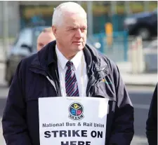  ??  ?? Bus driver Allister Kee on the picket line in Sligo.