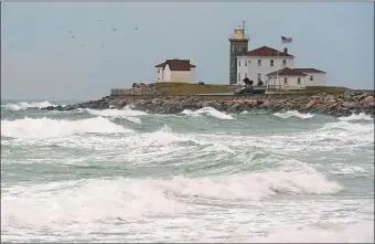  ?? DANA JENSEN/THE DAY ?? Watch Hill Light overlooks strong waves rolling towards the shore of East Beach in the Watch Hill section of Westerly in November, 2017.